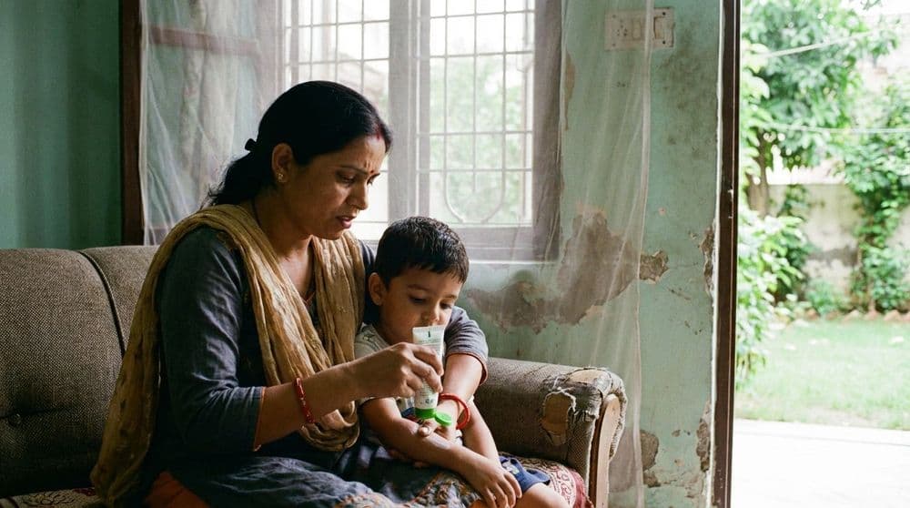 A North Indian mother protecting her child from insect bites by applying repellent, a key preventative measure for the Chandipura virus. A North Indian mother protecting her child from insect bites by applying repellent, a key preventative measure for the Chandipura virus.